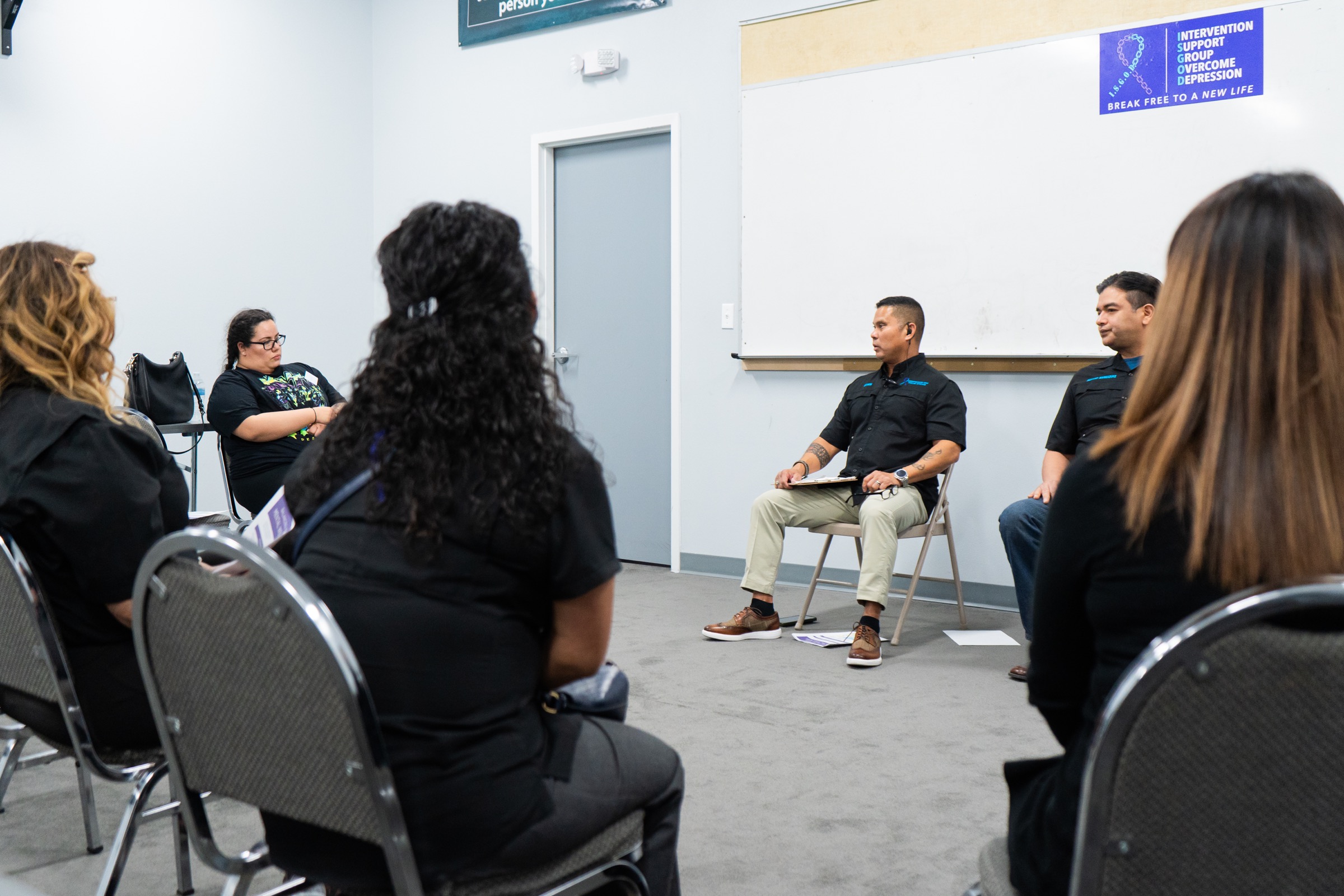 Adults gathering for an ISGOD peer support meeting